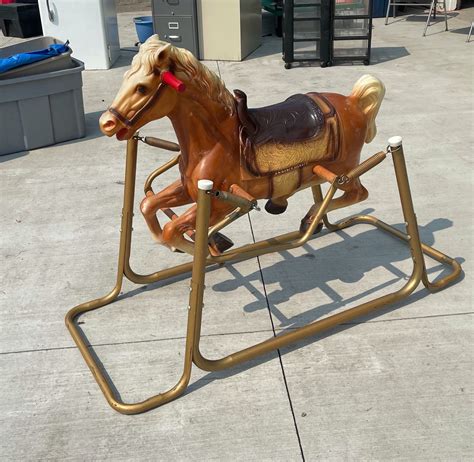 Have any idea what its worth, good condition. . Vintage rocking horse on springs